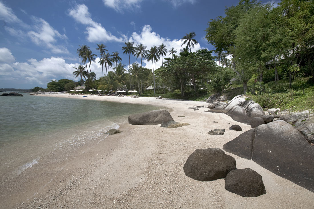 a beach with rocky sand